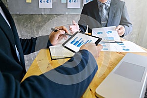 Business team discussing on digital tablet in a meeting