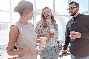 Business team is discussing something during the coffee break