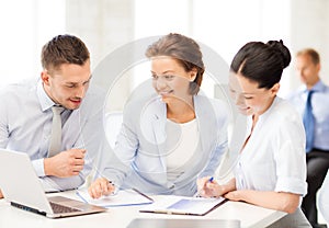 Business team discussing something in office