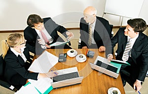 Business Team discussing various proposals