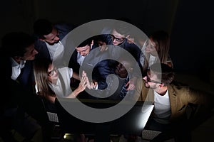 Business team enjoys good news and congratulating each other on success