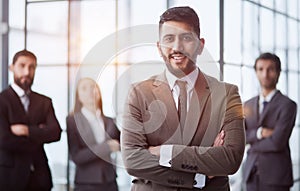 business team friendly group of four coworkers posing at office standing close together