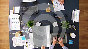 Business team with gadgets working at office table