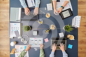 Business team with gadgets working at office table