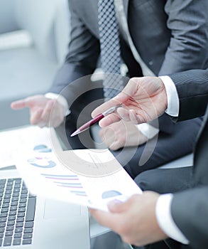 Business team hands at work with financial reports