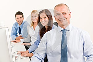 Business team happy sit in line behind table photo