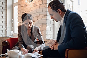 Business-team having a meeting at a coffee bar