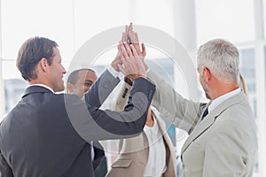 Business team high fiving