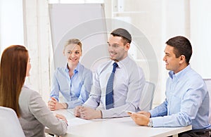 Business team interviewing applicant in office