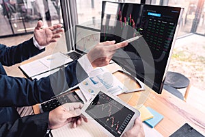 Business Team Investment Entrepreneur Trading discussing and analysis data the stock market charts and graphs negotiation and rese