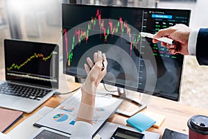 Business Team Investment Entrepreneur Trading discussing and analysis data the stock market charts and graphs negotiation and rese