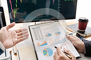 Business Team Investment Entrepreneur Trading discussing and analysis data the stock market charts and graphs negotiation and rese