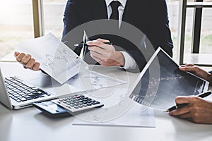 Business team investment working with computer and analysis graph stock market trading with stock chart data, business and techno