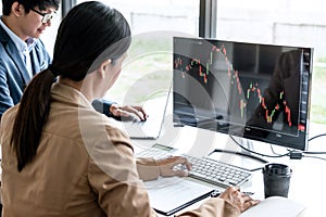 Business team investment working with computer, planning and analyzing graph stock market trading with stock chart data, business
