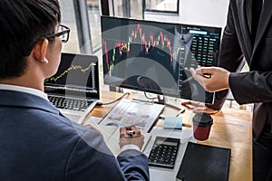 Business team investment working with computer, planning and analyzing graph stock market trading with stock chart data, business