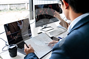 Business team investment working with computer, planning and analyzing graph stock market trading with stock chart data, business