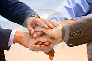 Business team joining hands together