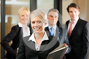 Business Team with leader in office photo