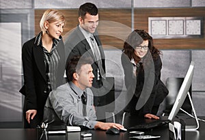 Business team looking at screen