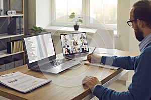 Business team manager having an online conference with his employees and coworkers