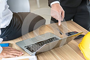 Business team meeting discuss work plan. manager and employee pointing computer screen and showing plan of project work.