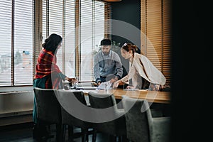 Business team in a meeting discussing project details, costs, and solutions in an office