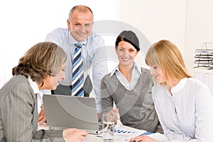 Business team meeting people around table