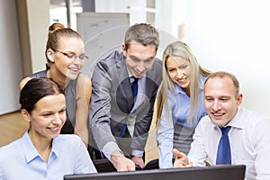 Business team with monitor having discussion