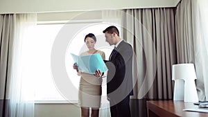 Business team with papers working at hotel room