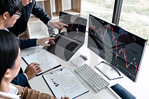 Business team partner working with computer, laptop, discussion and analyzing graph stock market trading with stock chart data