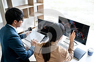 Business team partner working with computer, laptop, discussion and analyzing graph stock market trading with stock chart data