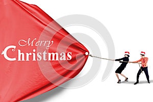 Business team pull christmas banner