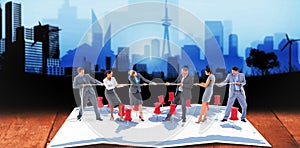 Composite image of business team pulling the rope
