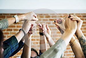 Business team raising their hands up to celebrate photo