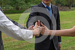 Business team showing hand of success symbol