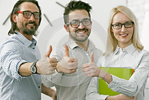 Business Team showing thumbs up gesture. Office workers expressing a positive mood is showing a thumb up sign meaning