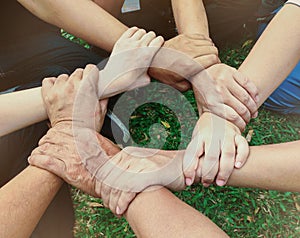 Business team standing hands together people joining for cooperation success business. Teamwork concept