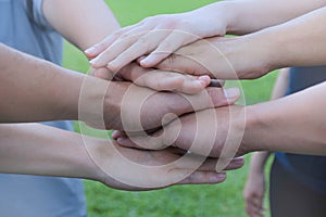 Business team standing and stack their hands together people joining for cooperation success business. Teamwork concept