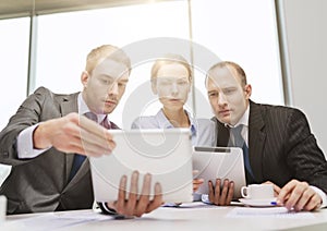 Business team with tablet pc having discussion