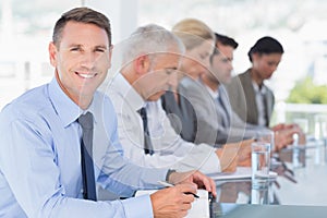 Business team taking notes during conference