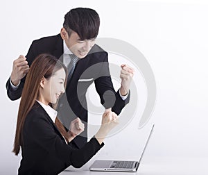 Business team using laptop and working together in office