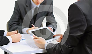 Business team using tablet computer to work