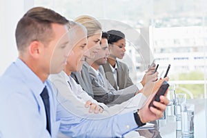 Business team using their mobile phone