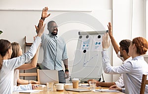 Business team voting concept, african coach and employees raise hands