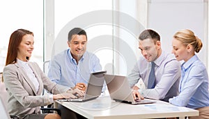 Business team working with laptop in office