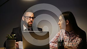 Business team working late overtime on laptop at cozy workplace