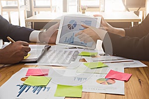 Business team working on tablet and documents at workplace wooden desk in office. Business Team Corporate Organization Working Co