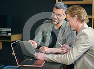 Business Team Working Together on Laptop