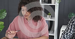 Business team writing notes at office desk