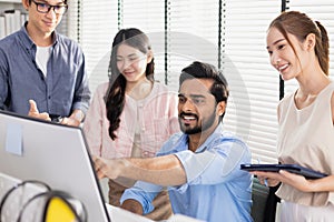 Business teamwork brainstorming strategy marketing planning. Male manager presentation with computer for female worker inside